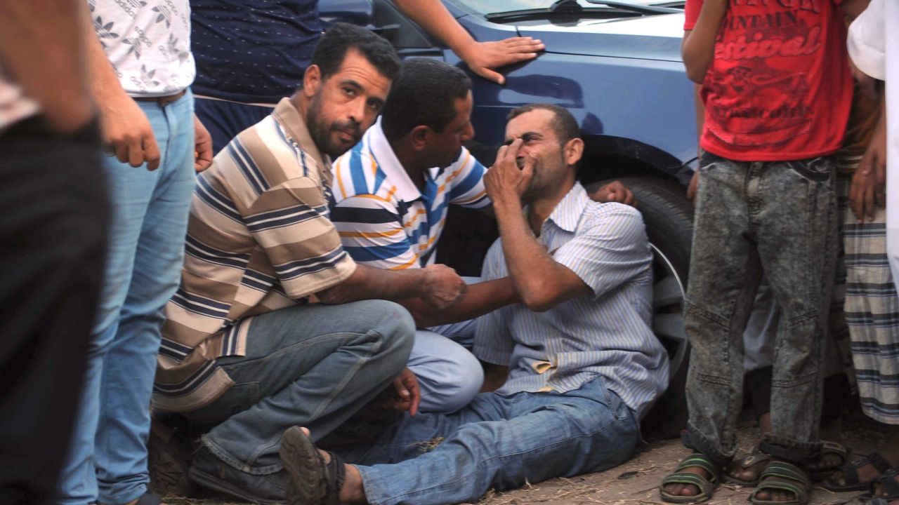 A relative of a person on board the capsized boat, pictured in the port city of Rashid, Egypt.
