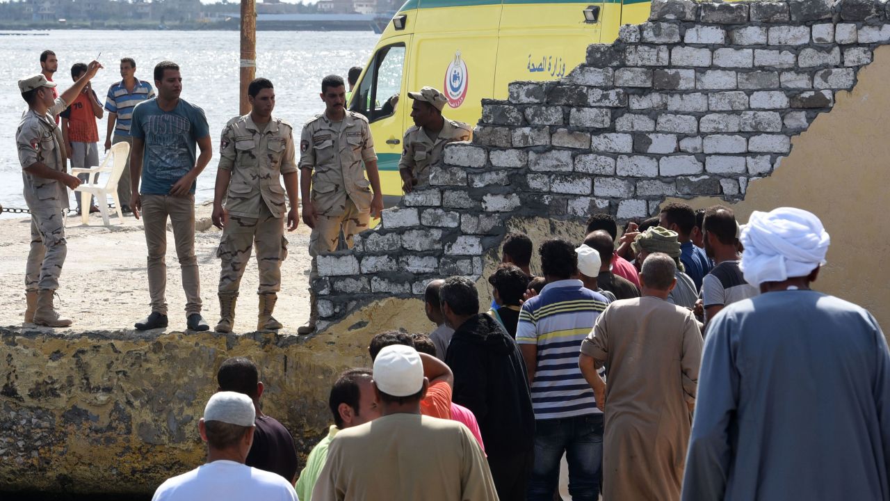 People gather in Rashid, as the search and rescue operation continues on Thursday September 22. 