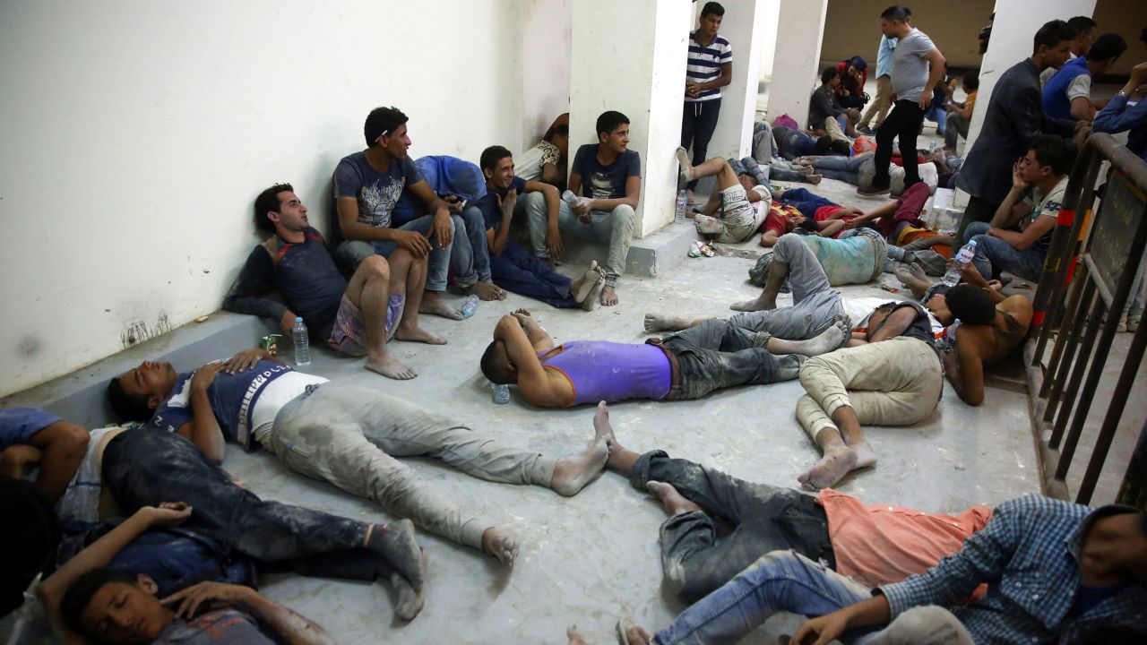 Survivors, rescued by Egyptian Coast Guard members from a boat submerged on its way to Europe at the Mediterranean Sea.