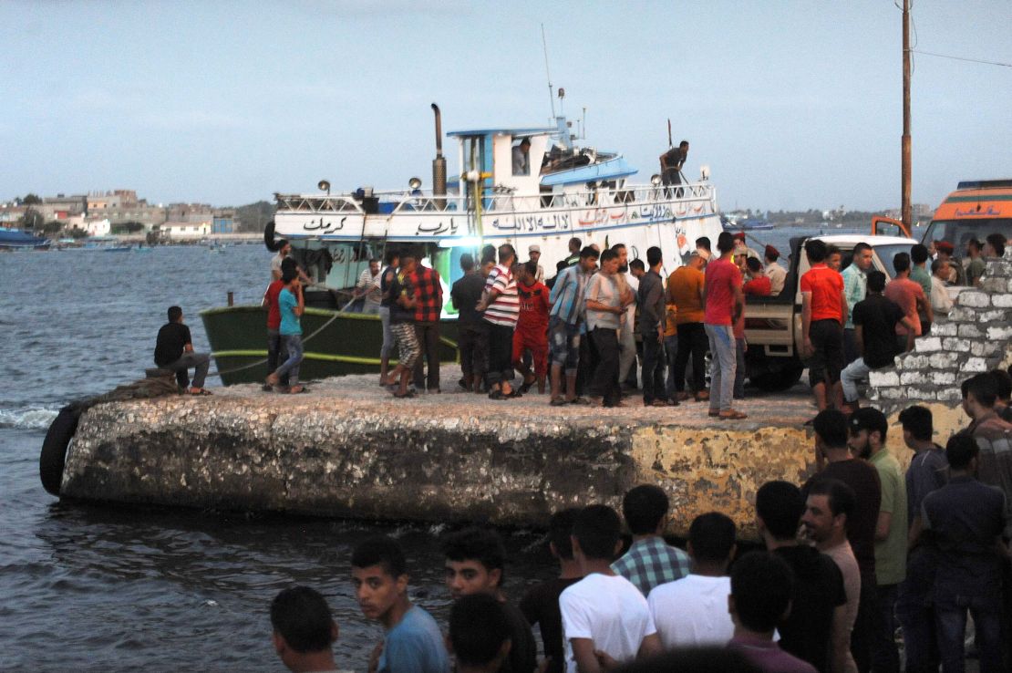 People gather at the port at Rashid.
