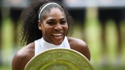 TOPSHOT - US player Serena Williams poses with the winner's trophy, the Venus Rosewater Dish, after her women's singles final victory over Germany's Angelique Kerber on the thirteenth day of the 2016 Wimbledon Championships at The All England Lawn Tennis Club in Wimbledon, southwest London, on July 9, 2016. / AFP / GLYN KIRK / RESTRICTED TO EDITORIAL USE        (Photo credit should read GLYN KIRK/AFP/Getty Images)