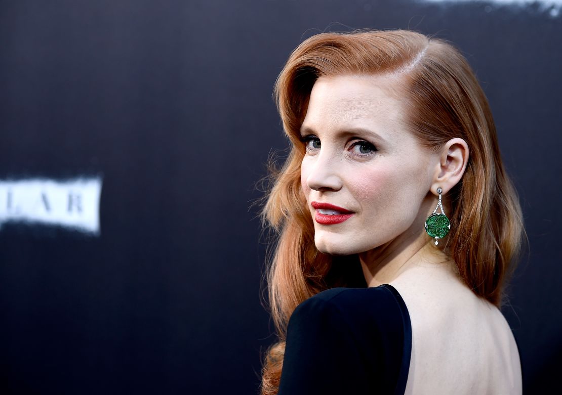 Actress Jessica Chastain shows off her jade earrings at the 2014 premiere of "Interstellar" in Hollywood, California.