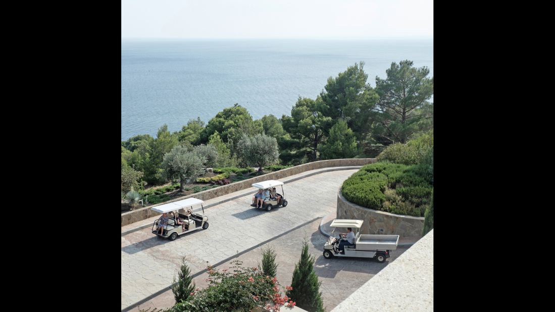 People ride golf carts at a Crimean resort.