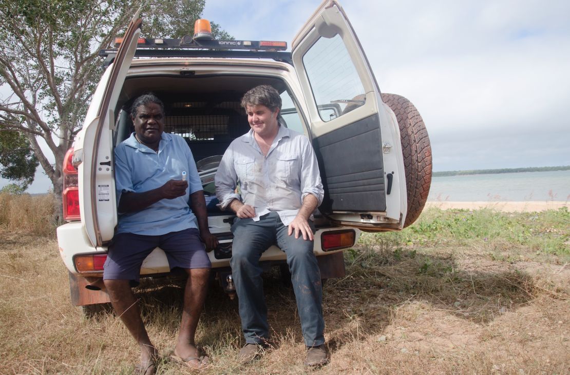 Researcher Michael Westaway taking saliva samples with Elder Thomas Wales.