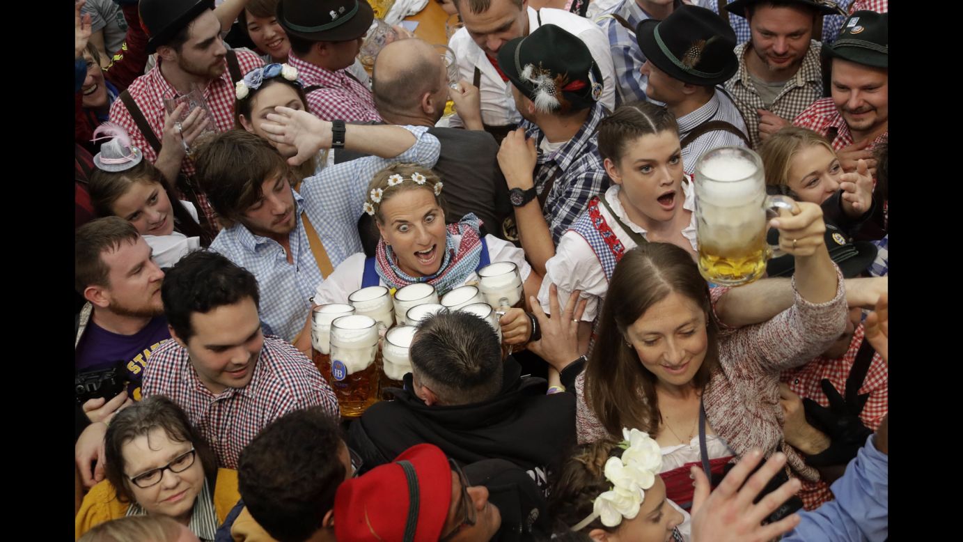 A waitress holds beer glasses at the Oktoberfest opening in Munich, Germany, on Saturday, September 17. Oktoberfest is the world's largest beer festival. <a href="http://www.cnn.com/2016/09/21/world/gallery/tbt-oktoberfest/index.html" target="_blank">Check out these lighthearted Oktoberfest photos from the past century</a>