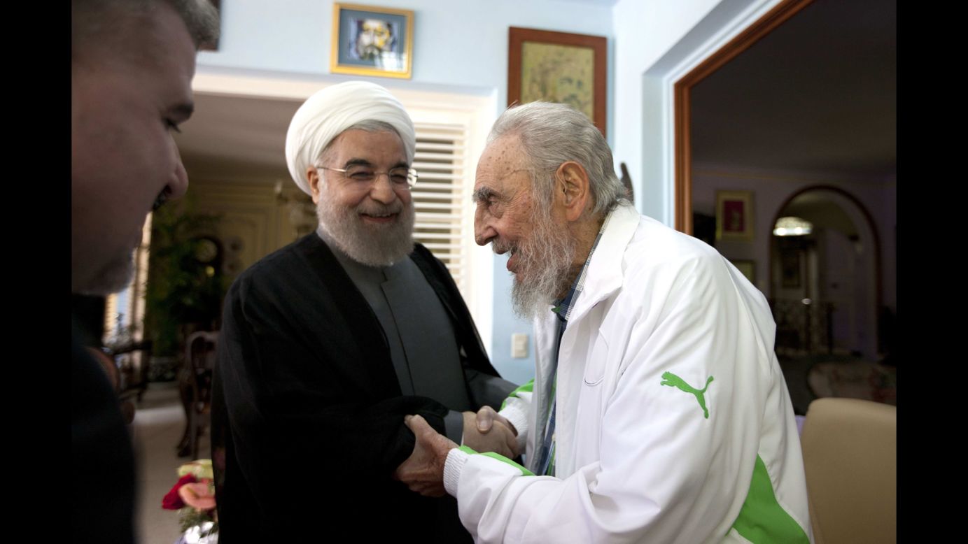 Iranian President Hassan Rouhani, center, shakes hands with former Cuban leader Fidel Castro during a visit to Havana, Cuba, on Monday, September 19.