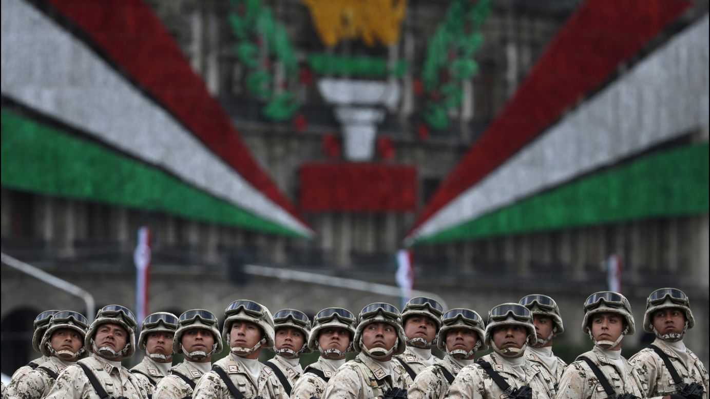 Mexican soldiers look up toward their President during the Independence Day military parade on Friday, September 16.