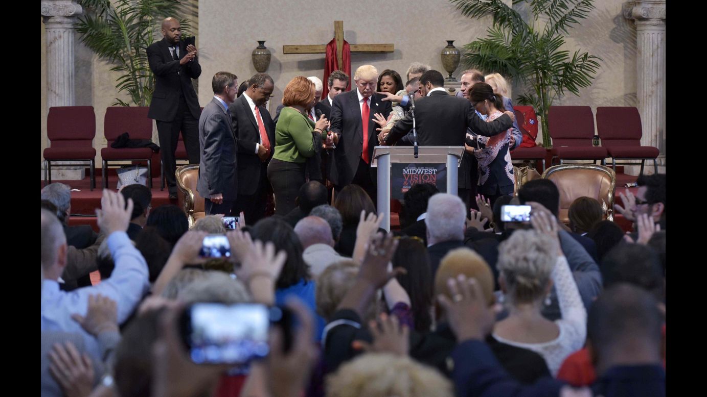 People pray with Donald Trump, the Republican Party's presidential nominee, during the Midwest Vision and Values Pastors and Leadership Conference. The event was held in Cleveland Heights, Ohio, on Wednesday, September 21.