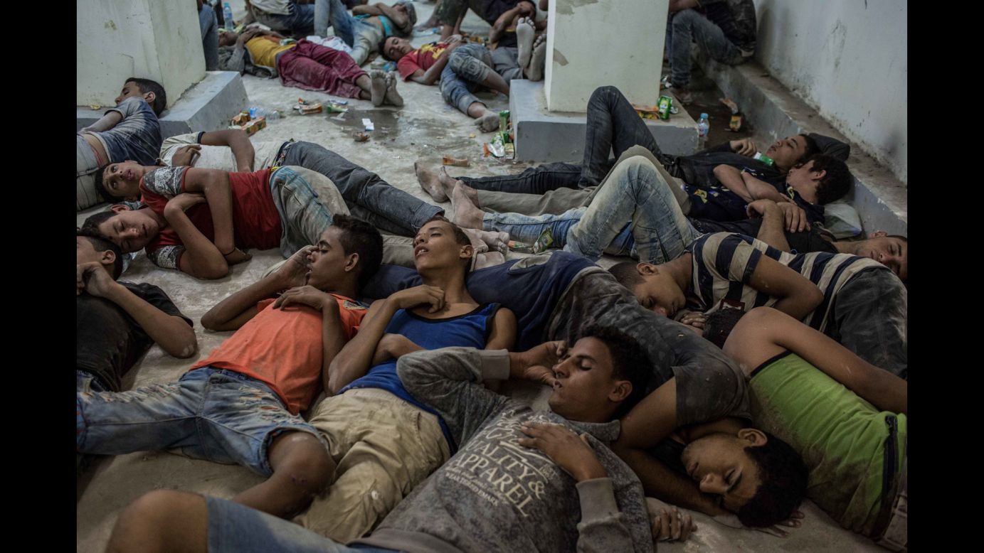 Young people sleep on a police station floor in Rosetta, Egypt, after being rescued from <a href="http://www.cnn.com/2016/09/22/middleeast/migrant-boat-capsize-egypt-arrests/" target="_blank">a capsized boat</a> off the Mediterranean coast on Wednesday, September 21. <a href="http://www.cnn.com/2015/09/03/world/gallery/europes-refugee-crisis/index.html" target="_blank">Europe's migration crisis in 25 photos</a>