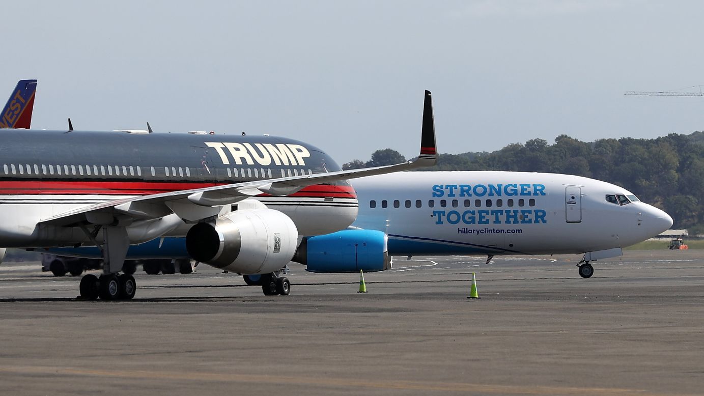 The campaign planes of presidential candidates Donald Trump and Hillary Clinton sit on the tarmac Friday, September 16, at Reagan National Airport near Washington.