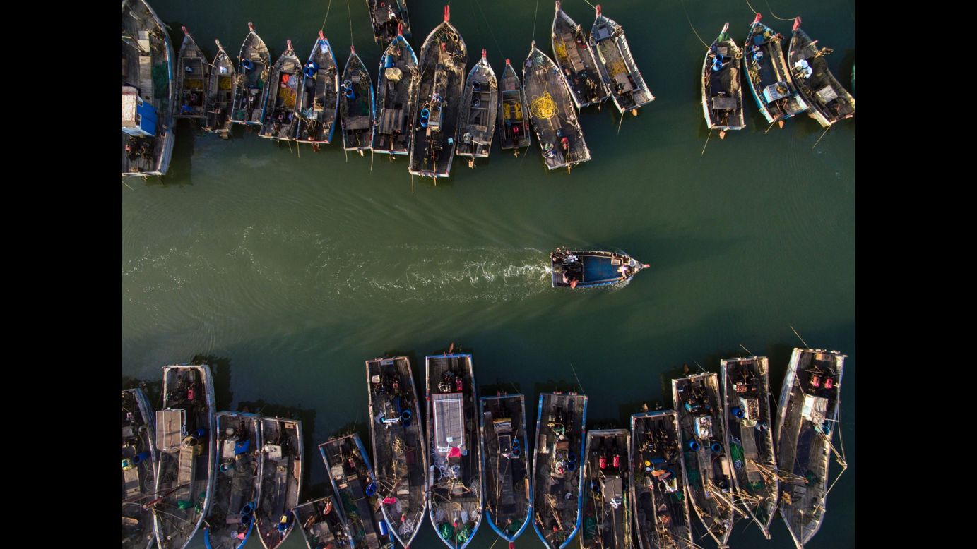A fishing boat heads out to sea in the Chinese province of Lianoning on Monday, September 19.