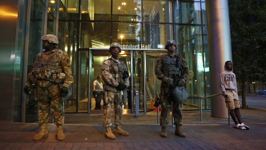 CHARLOTTE, NC - SEPTEMBER 22: The North Carolina National Guard stands at their post in Uptown Charlotte on September 22, 2016 in Charlotte, North Carolina.  As activists continue to protest the death of Keith Scott, police prepare for another round of possible unrest. Scott, 43,  was shot and killed by police officers at an apartment complex near UNC Charlotte. (Photo by Brian Blanco/Getty Images)