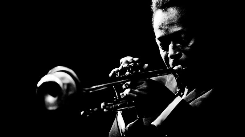 Miles Davis plays the trumpet at the Monterey Jazz Festival in Monterey, California, in 1964. It's one of the images in a new book, <a href="index.php?page=&url=http%3A%2F%2Fwww.reelartpress.com%2Fcatalog%2Fedition%2F90%2Fjazz-festival-jim-marshall" target="_blank" target="_blank">"Jazz Festival"</a> by legendary music photographer Jim Marshall.