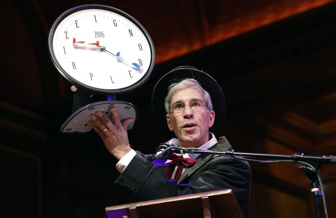 Master of Ceremonies Marc Abrahams holds up the 2016 Ig Nobel award during ceremonies at Harvard University in Cambridge, Mass., Thursday, Sept. 22, 2016. 