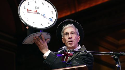 Master of Ceremonies Marc Abrahams holds up the 2016 Ig Nobel award during ceremonies at Harvard University in Cambridge, Mass., Thursday, Sept. 22, 2016.