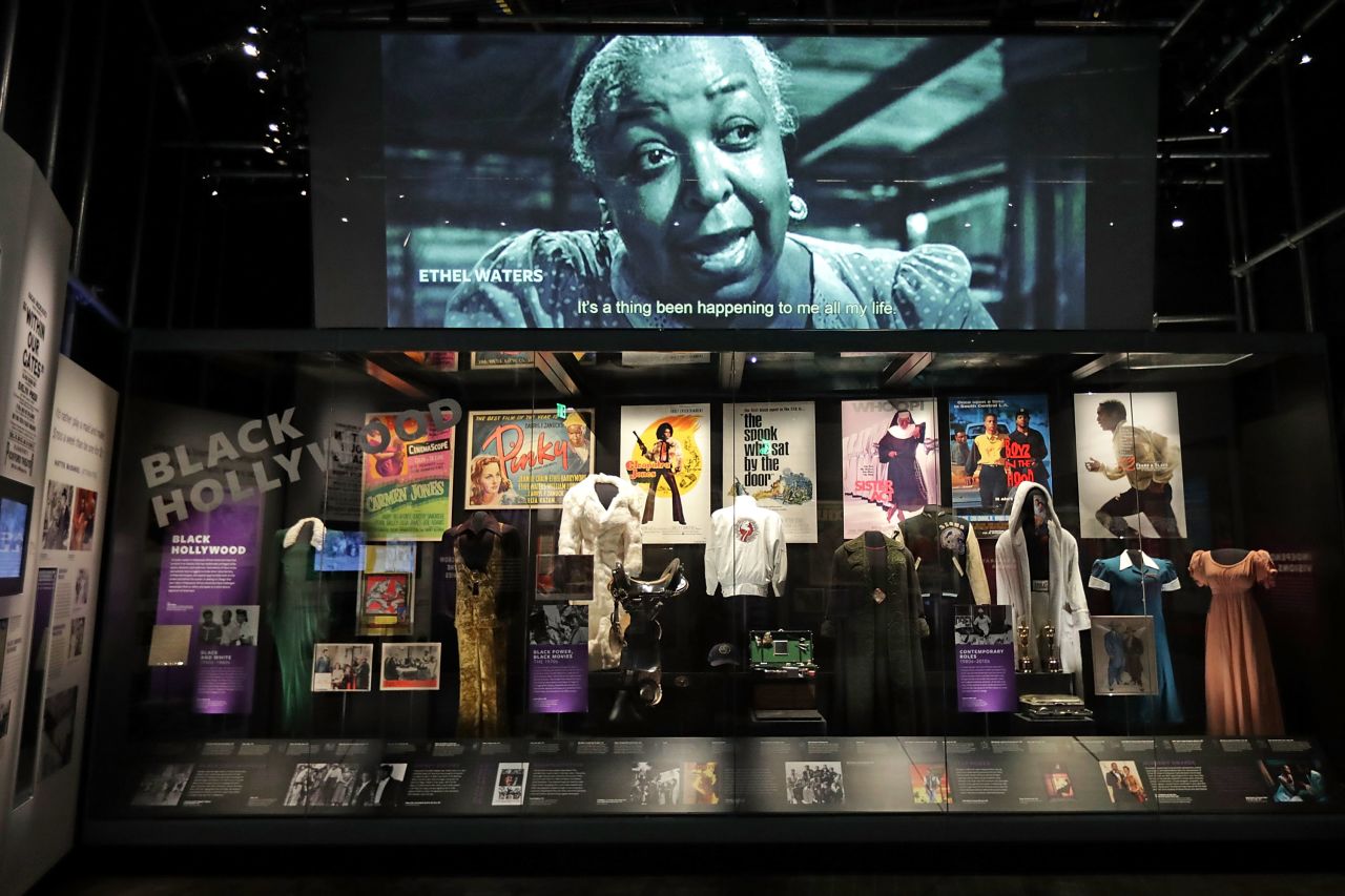 Costumes, props, posters and other artifacts on display in the Taking the Stage section of the museum