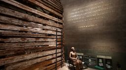 WASHINGTON, DC - SEPTEMBER 14:  A statue of Colorado pioneer and former slave Clara Brown is on display next to a preserved slave cabin at the Smithsonian's National Museum of African American History and Culture during the press preview on the National Mall September 14, 2016, in Washington, DC. Filled with exhibits and artifacts telling the story of the first Africans in the United States and their descendents, the 400,000-square-foot museum will open to the public on September 24.  (Photo by Chip Somodevilla/Getty Images)