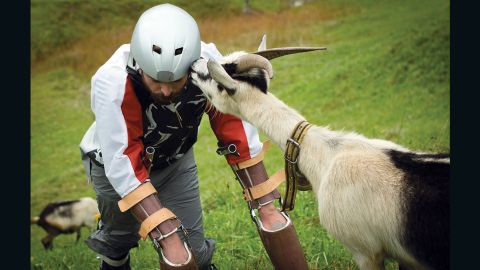 Goat man Thomas Thwaites bonds with an actual goat in the Alps.