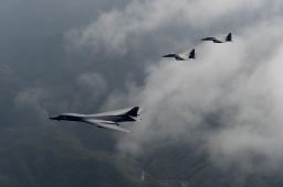 A U.S. Air Force B-1B Lancer, deployed to Andersen Air Base, Guam, is flanked by two F-15K Slam Eagles, assigned to Daegu Air Base, South Korea, during a flight over South Korea Sept. 21, 2016. 