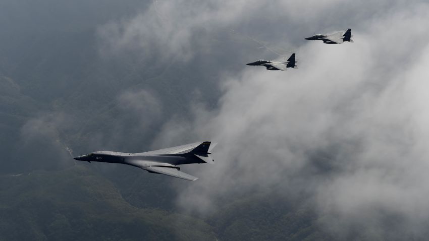 A U.S. Air Force B-1B Lancer, deployed to Andersen Air Base, Guam, is flanked by two F-15K Slam Eagles, assigned to Daegu Air Base, South Korea, during a flight over South Korea Sept. 21, 2016. The B-1 is the backbone of the U.S. long-range bomber mission and is capable of carrying the largest payload of both guided and unguided weapons in the Air Force inventory. (South Korean air force photo/Chief Master Sgt. Kim, Kyeong Ryul)