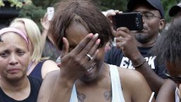 Diamond Reynolds, the girlfriend of Philando Castile of St. Paul, cries outside the governor's residence in St. Paul, Minn., on Thursday, July 7, 2016.  Castile was shot and killed after a traffic stop by police in Falcon Heights, Wednesday night. A video shot by Reynolds of the shooting  went viral.  (AP Photo/Jim Mone)
