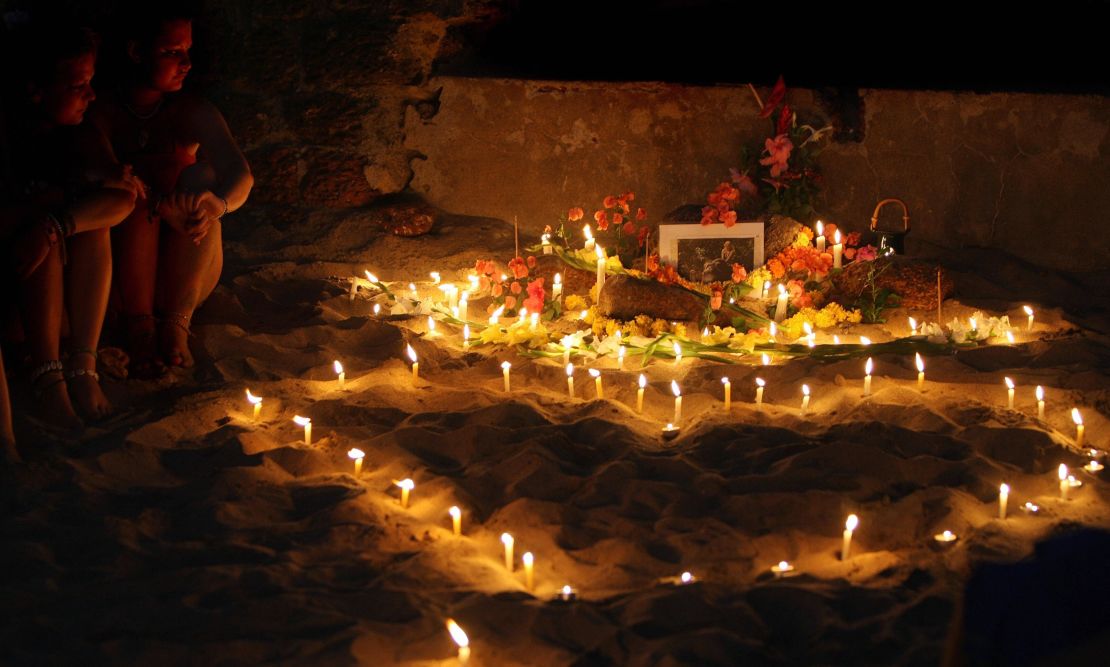 People hold an inpromptu tribute on Anjuna beach on the first anniversary of the girl's death in 2009. 