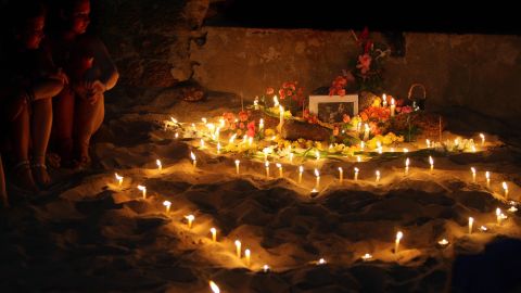 People hold an inpromptu tribute on Anjuna beach on the first anniversary of the girl's death in 2009.