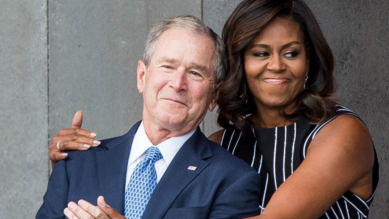 George W. Bush receives a hug from Michelle Obama in September 2016.  