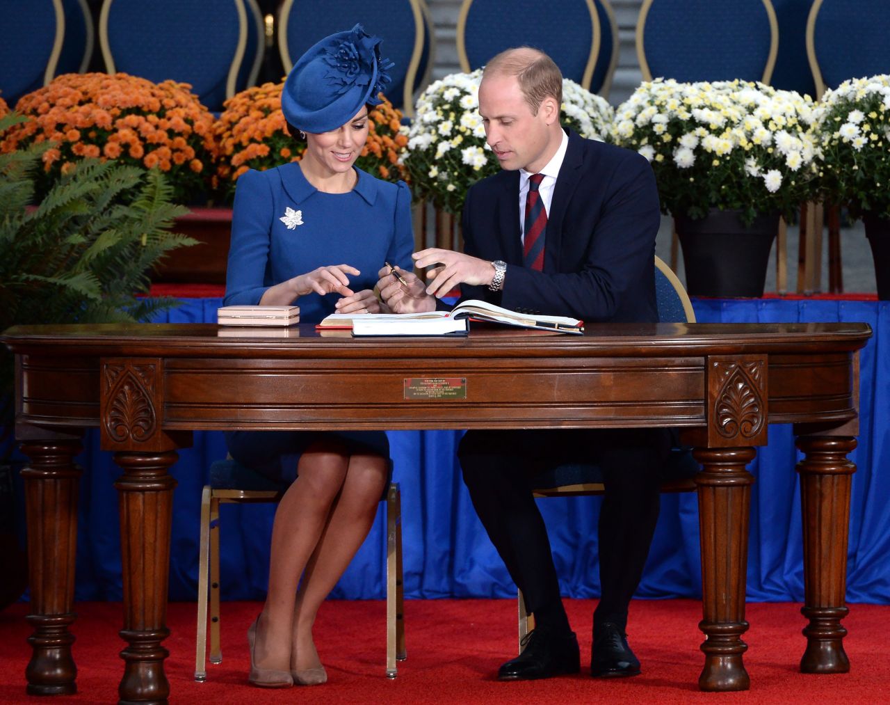 The royals sign the Canadian government's Golden Book at the Legislative Assembly in Victoria on September 24. 