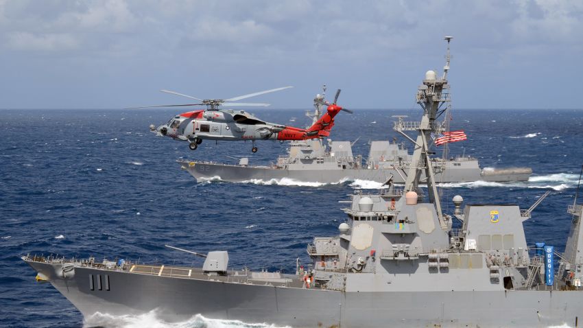 160715-N-YU572-321
INDIAN OCEAN (July 15, 2016) An MH-60R Seahawk, attached to the "Warbirds" of Helicopter Maritime Strike Squadron (HSM) 49, flies over the guided-missile destroyers USS Spruance (DDG 111) and USS Momsen (DDG 92). The guided-missile destroyers Spruance, Momsen and USS Decatur (DDG 73) are deployed in support of maritime security and stability in the Indo-Asia Pacific as part of a U.S. 3rd Fleet Pacific Surface Action Group (PAC SAG) under Commander, Destroyer Squadron (CDS) 31. (U.S. Navy photo by Naval Aircrewman 2nd Class Alex Hewette/Released)