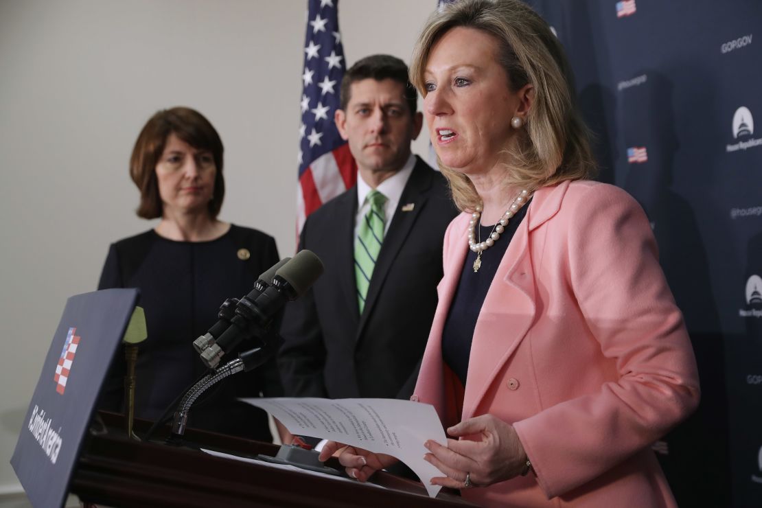 Virginia Rep. Barbara Comstock beside House Speaker Paul Ryan and Washington Rep. Cathy McMorris Rodgers, in black