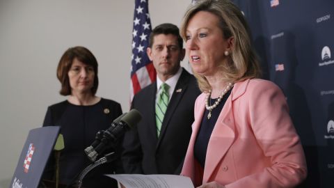 Virginia Rep. Barbara Comstock beside House Speaker Paul Ryan and Washington Rep. Cathy McMorris Rodgers, in black