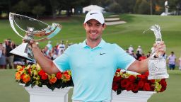 Rory McIlroy of Northern Ireland poses with the FedExCup and Tour Championship trophies after his double triumph in Atlanta.