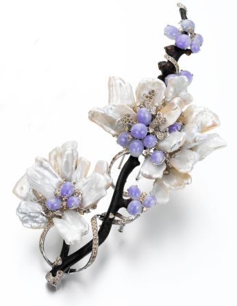 An 18K white gold brooch made with lavender jadeite, black coral, pearl and diamonds from Edward Chiu Jewellery Art. 