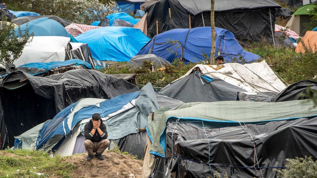 A man is seen among tents in "The Jungle" in October 2015.
