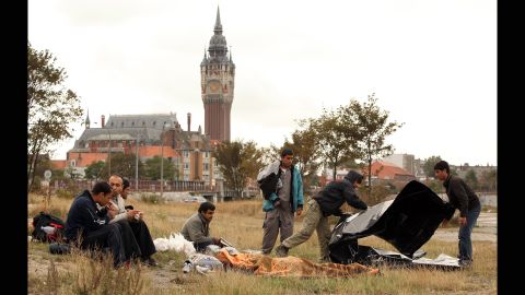 Displaced from "The Jungle" camp, Afghan migrants congregate in Calais' harbor in September 2009.