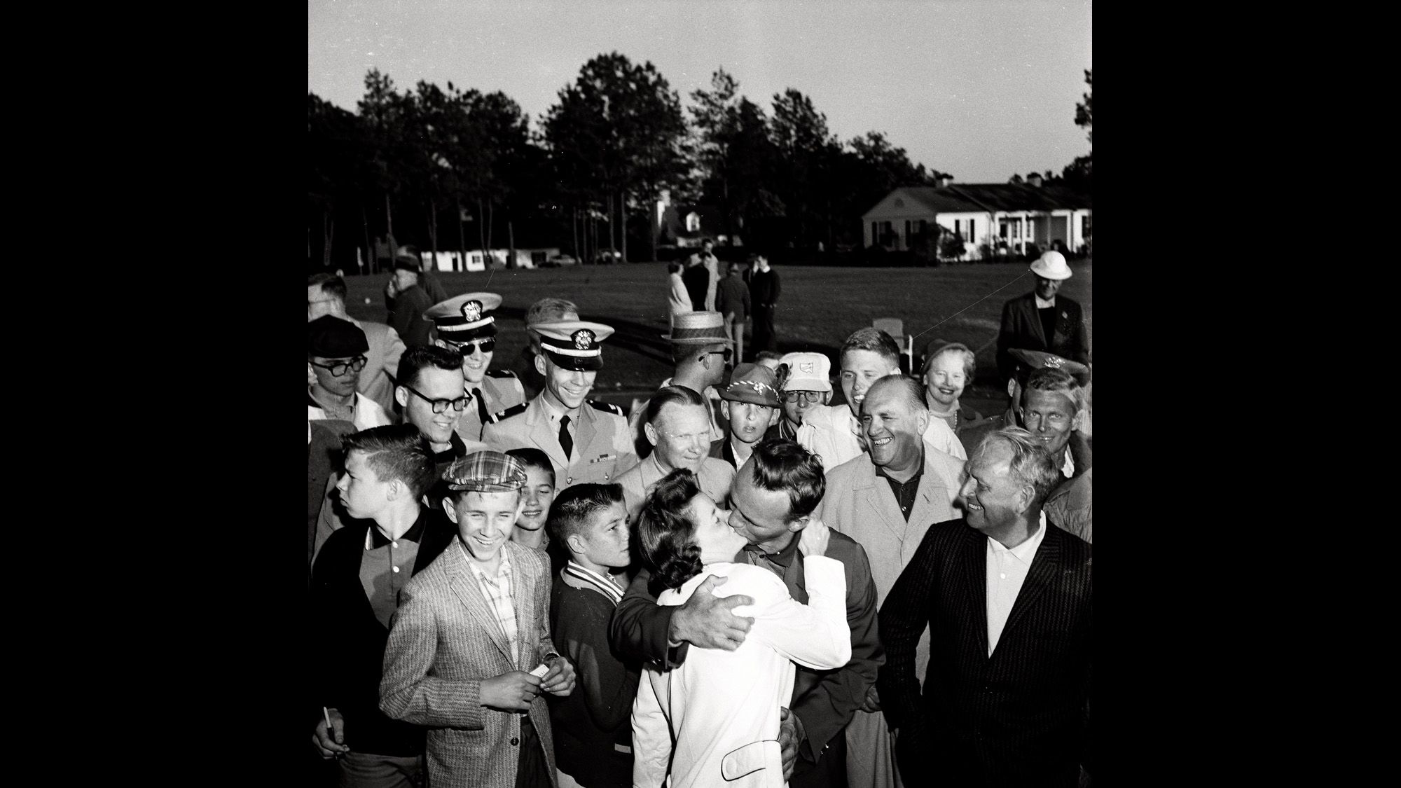 Palmer kisses his wife Winifred Walzer at the end of the tournament 56 years ago.