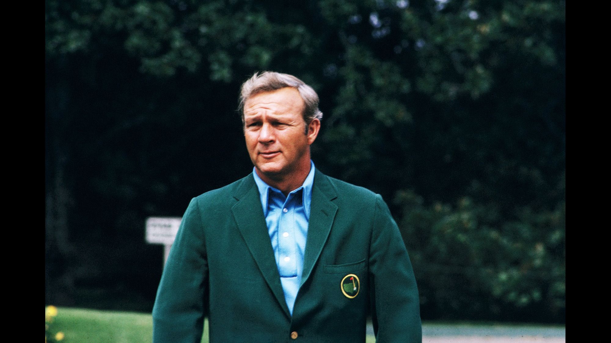 Palmer donning his green jacket during the 1973 Masters.
