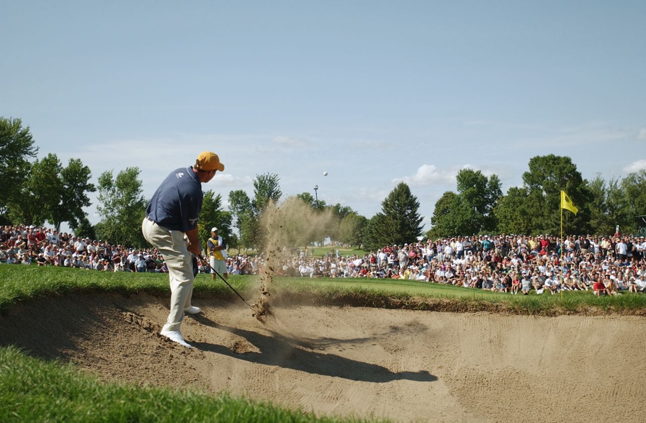 That year Rich Beem -- pictured hitting out of the bunker at hole No. 8 -- was a surprise champion, with Tiger Woods runner-up. It would be Beem's only major title. 