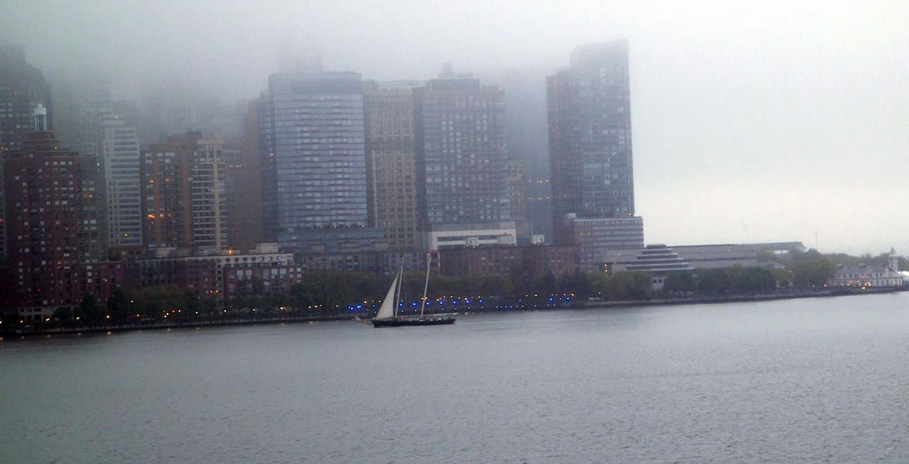 They came into port early in the morning, and the mist covered the tops of Manhattan's skyscrapers.
