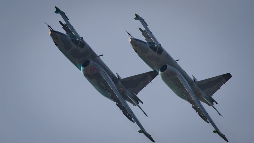 This photo taken on September 24, 2016 shows Sukhoi SU-25 aircraft performing during the first Wonsan Friendship Air Festival in Wonsan.
Just weeks after carrying out its fifth nuclear test, North Korea put on an unprecedented civilian and military air force display Saturday at the country's first ever public aviation show.
 / AFP / Ed Jones        (Photo credit should read ED JONES/AFP/Getty Images)