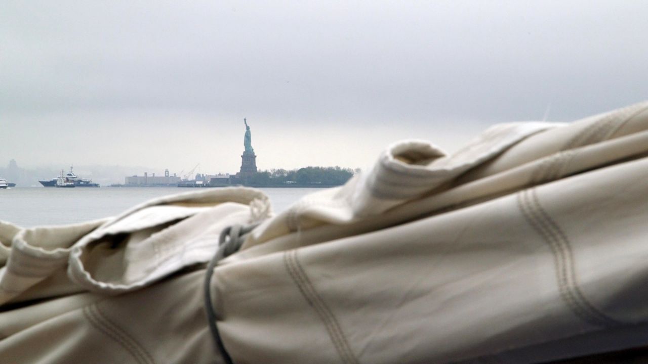 The Statue of Liberty was one of the first things the crew of America saw when they emerged from the fog of New York Harbor.