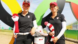 RIO DE JANEIRO, BRAZIL - AUGUST 16:  Brooke Henderson of Canada (L)  poses with her sister/caddie Brittany during a practice round prior to the start of the women's golf during Day 11 of the Rio 2016 Olympic Games at Olympic Golf Course on August 16, 2016 in Rio de Janeiro, Brazil.  (Photo by Scott Halleran/Getty Images)