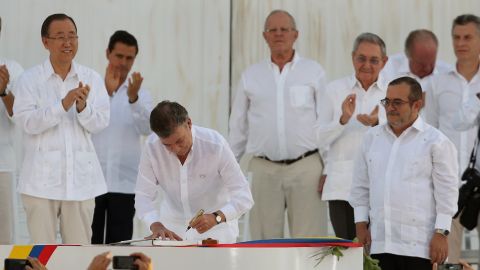 Colombia's President Juan Manuel Santos signs the peace agreement between Colombia's government and the FARC, to end over 50 years of conflict, in Cartagena, Colombia, Monday, September 26.