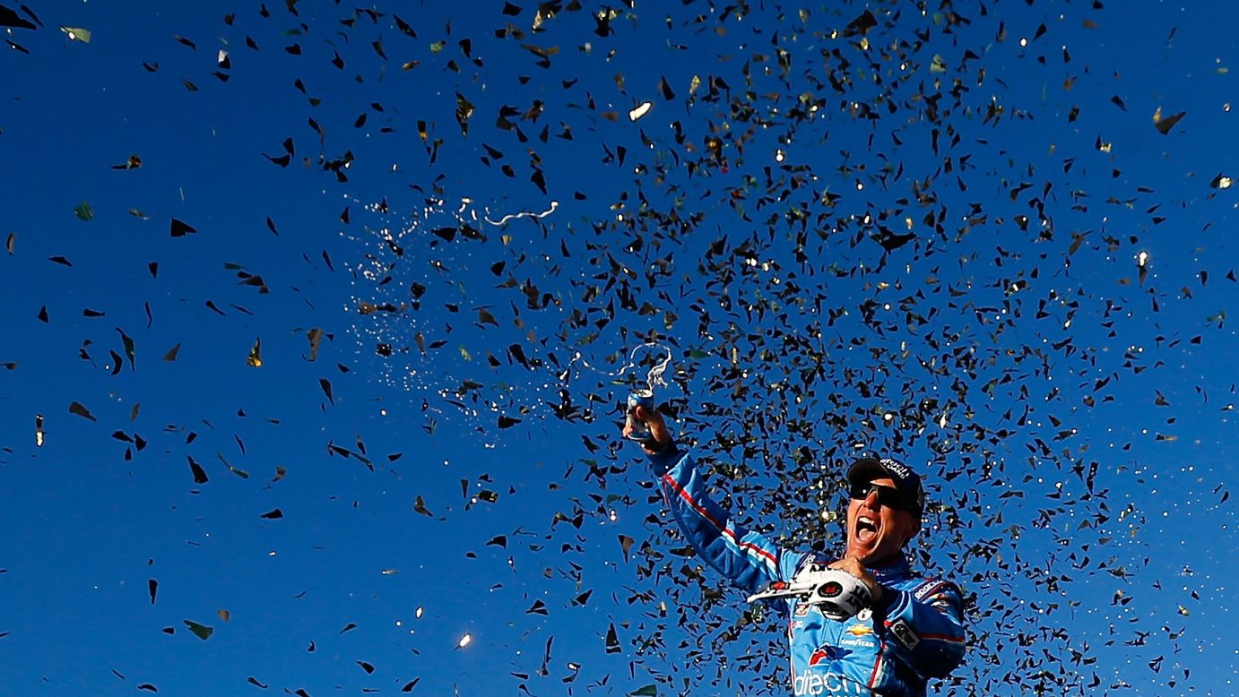Confetti falls around NASCAR driver Kevin Harvick after he won a Sprint Cup race in Loudon, New Hampshire, on Sunday, September 25. The victory clinched him a spot in the second round of the Chase for the Cup.