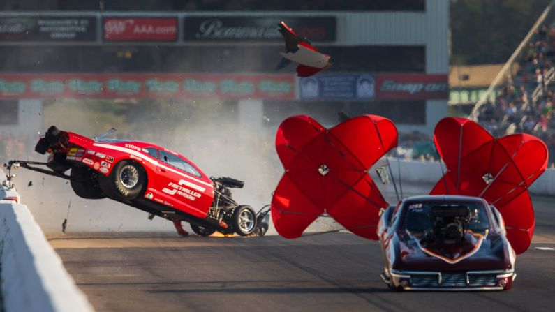 The car of drag racer Jay Payne goes airborne during a race against Chuck Little in Madison, Illinois, on Friday, September 23. Payne walked away from the crash.