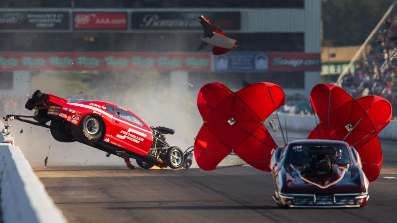 The car of drag racer Jay Payne goes airborne during a race against Chuck Little in Madison, Illinois, on Friday, September 23. Payne walked away from the crash.