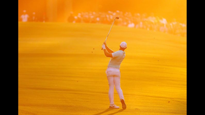 Rory McIlroy hits an approach shot on the fourth playoff hole of the Tour Championship on Sunday, September 25. McIlroy birdied the hole to hold off Ryan Moore and <a href="http://www.cnn.com/2016/09/25/golf/fedexcup-mcilroy-moore-chappell-johnson/" target="_blank">win the FedEx Cup.</a>