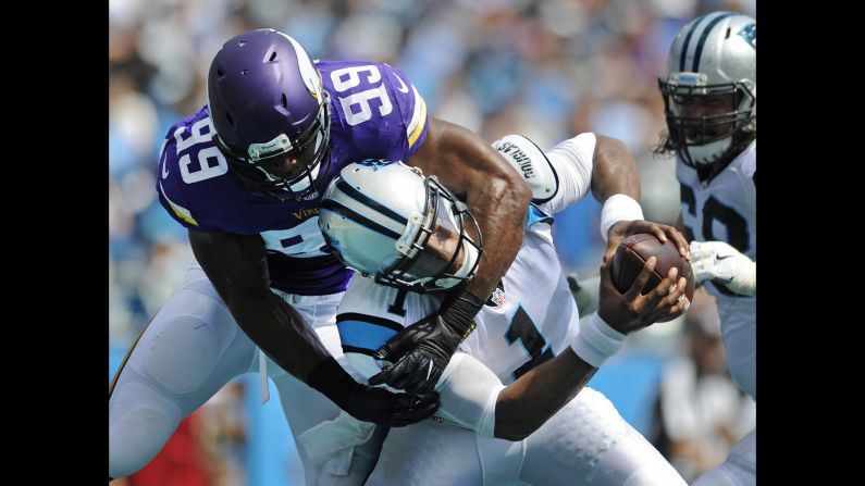 Carolina quarterback Cam Newton is sacked in the end zone by Minnesota's Danielle Hunter during an NFL game in Charlotte, North Carolina, on Sunday, September 25. The Vikings sacked Newton eight times en route to a 22-10 victory.