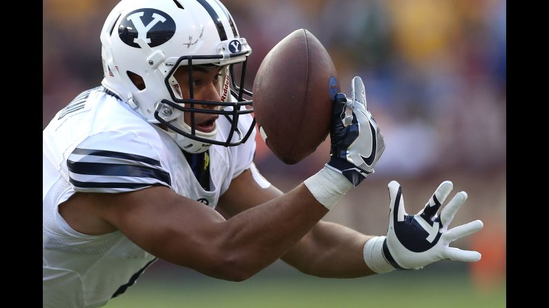 BYU wide receiver Moroni Laulu-Pututau focuses on the ball as he tries to make a catch against West Virginia on Saturday, September 24.